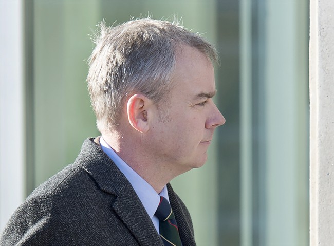 Dennis Oland heads to the Law Courts where he was found guilty of second degree murder in the death of his father, Richard Oland, in Saint John, N.B. on Saturday, Dec. 19, 2015.