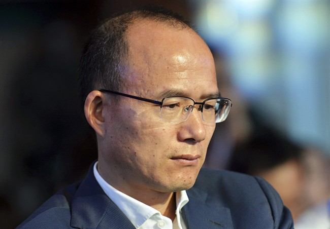 In this June 25, 2015 photo, Guo Guangchang attends the opening ceremony of the new Internet bank MYbank in Hangzhou in east China's Zhejiang province.