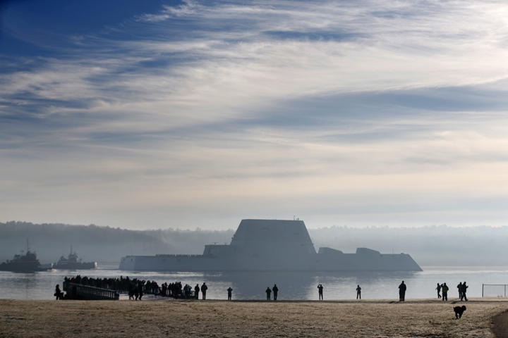The first Zumwalt-class destroyer, the largest ever built for the U.S. Navy, heads down the Kennebec River after leaving Bath Iron Works, Monday, Dec. 7, 2015, in Bath, Maine. The ship is headed out to sea for the first time to undergo sea trials.