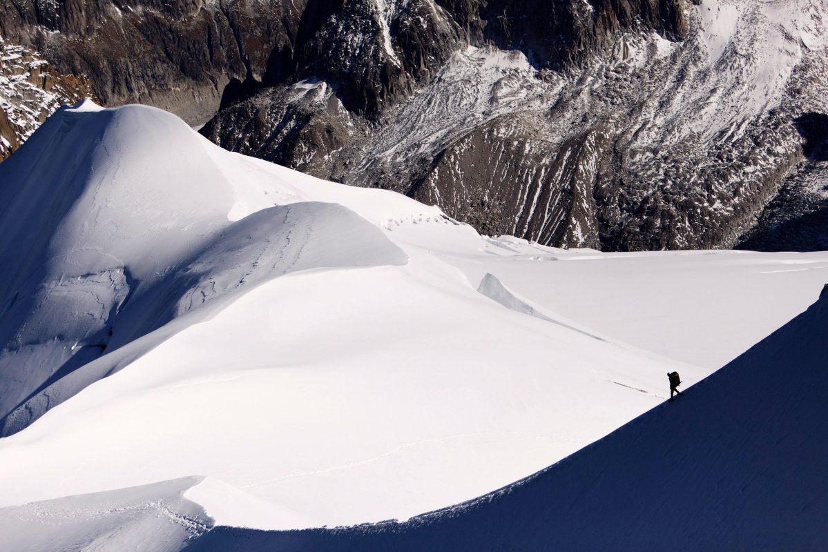 This Wednesday, Oct. 12, 2011 picture shows an alpinist heading down a ridge on the Aiguille du Midi towards the Vallee Blanche on the Mont Blanc massif, in the Alps, near Chamonix, France. 