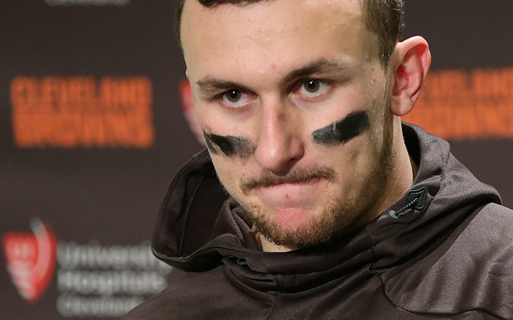 Cleveland Browns quarterback Johnny Manziel speaks with media members after an NFL football game against the Seattle Seahawks, Sunday, Dec. 20, 2015, in Seattle. 
