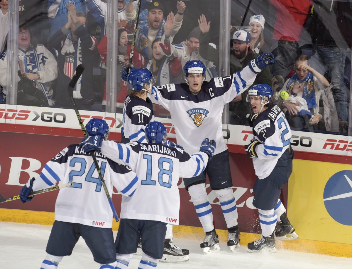Captain Mikko Rantanen of Finland, center, celebrates scoring with teammates during the 2016 IIHF World Junior Ice Hockey Championship final match between Finland and Russia in Helsinki, Finland, Tuesday Jan. 5, 2016. 