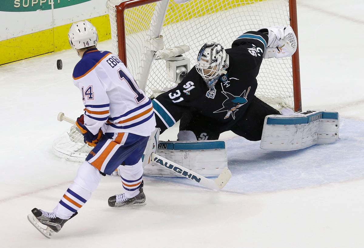 San Jose Sharks goalie Martin Jones (31) defends a shot by Edmonton Oilers right wing Jordan Eberle (14) during a shootout of an NHL hockey game in San Jose, Calif., Thursday, Jan. 14, 2016. The Sharks won 2-1 in an overtime shootout.