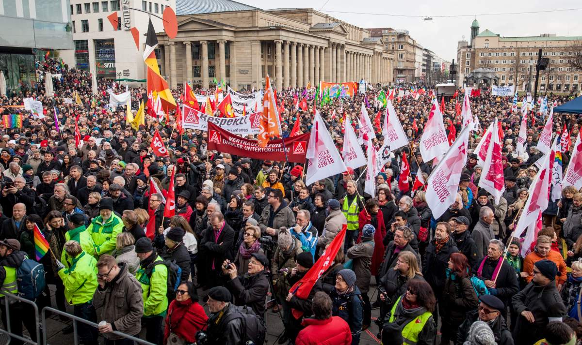 Peple gather in  the center of Stuttgart, Germany during a rally to support refugees Saturday Jan. 16, 2016.  