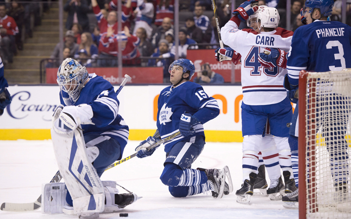 Toronto Maple Leafs goaltender James Reimer, right winger Pierre-Alexandre Parenteau and defenceman Dion Phaneuf react as Montreal Canadiens left winger Tomas Fleischmann is congratulated by teammate Daniel Carr after scoring the Canadiens second goal of the game during first period NHL action in Toronto on Saturday January 23, 2016. 