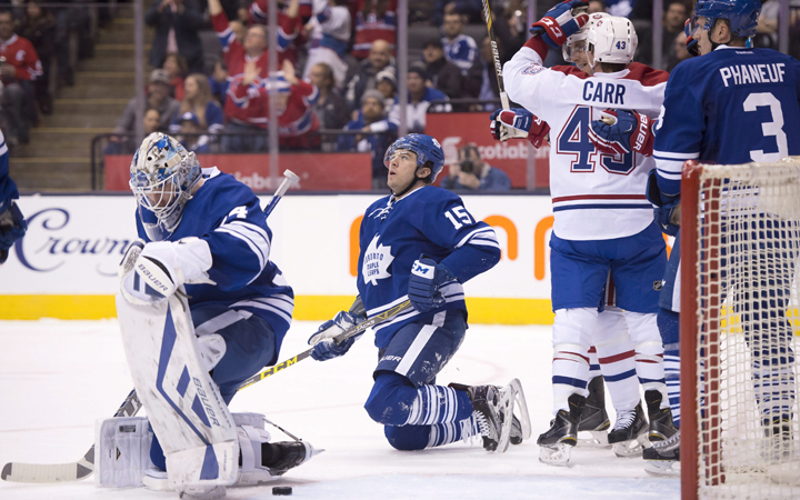 Toronto Maple Leafs goaltender James Reimer, right winger Pierre-Alexandre Parenteau and defenceman Dion Phaneuf react as Montreal Canadiens left winger Tomas Fleischmann is congratulated by teammate Daniel Carr after scoring the Canadiens second goal of the game during first period NHL action in Toronto on Saturday January 23, 2016. 