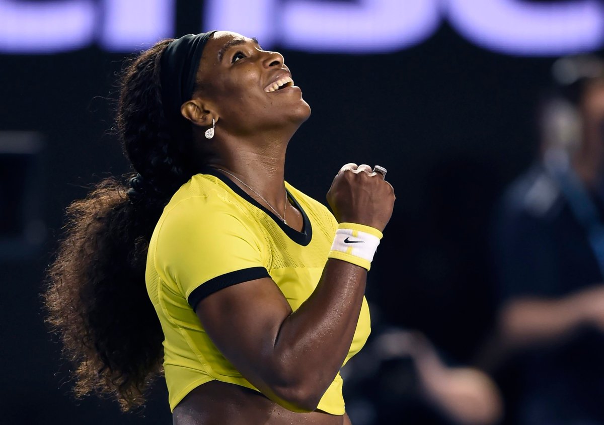 Serena Williams of the United States celebrates after defeating Agnieszka Radwanska of Poland in their semifinal match at the Australian Open tennis championships in Melbourne, Australia, Thursday, Jan. 28, 2016.