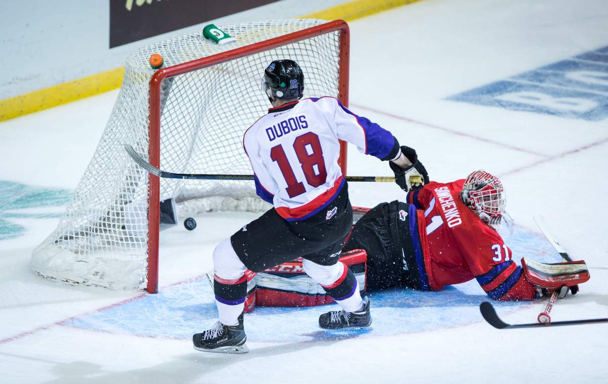 Team Orr's Pierre-Luc Dubois, left, scores what proved to be the winning goal against Team Cherry goalie Zach Sawchenko during third period CHL/NHL Top Prospects Game hockey action in Vancouver, B.C., on Thursday January 28, 2016. 