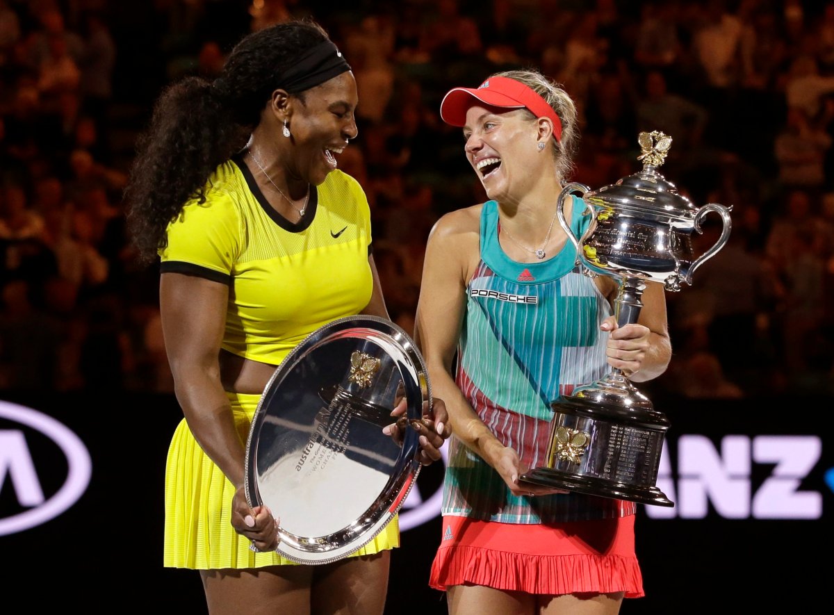 Angelique Kerber, right, of Germany enjoys a joke with runner-up Serena Williams of the United States after winning their women's singles final at the Australian Open tennis championships in Melbourne, Australia, Saturday, Jan. 30, 2016.