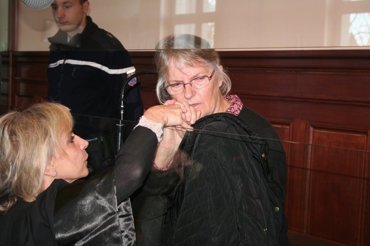 Jacqueline Sauvage, a French woman convicted of murdering her abusive husband, with her lawyer (no name given) in court in Blois, France on Dec. 3, 2015. 