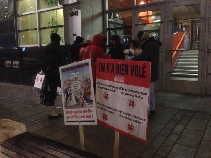 Protesters outside Montreal police headquarters on Saint-Urbain Street, Friday, January 29, 2016.