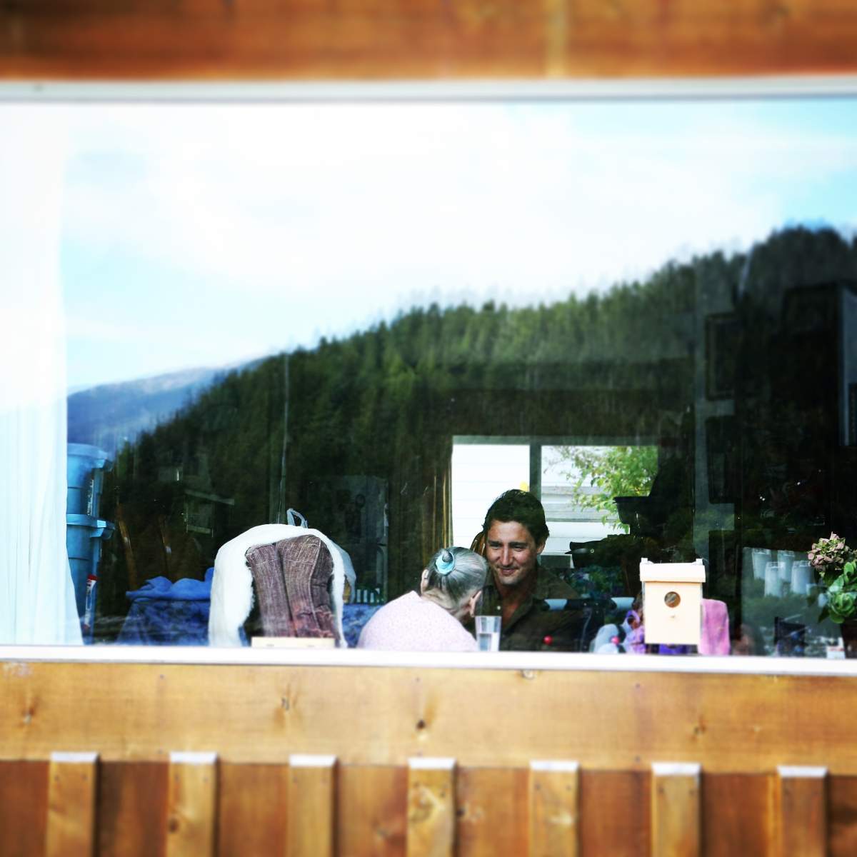 Justin Trudeau speaks with a woman