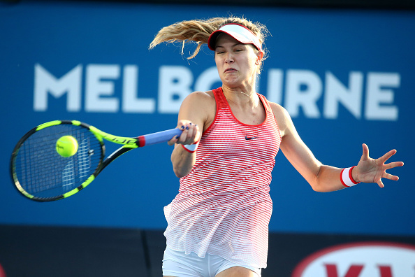 Eugenie Bouchard of Canada plays a forehand in her first round match against Aleksandra Krunic of of Serbia during day one of the 2016 Australian Open at Melbourne Park on January 18, 2016 in Melbourne, Australia.  (Photo by Scott Barbour/Getty Images).