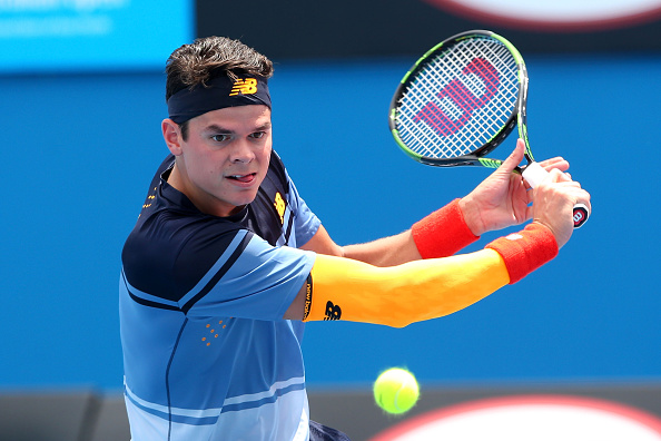 Milos Roanic of Canada plays a backhand in his first round match against Lucas Pouille of France during day two of the 2016 Australian Open at Melbourne Park on January 19, 2016 in Melbourne, Australia.  (Photo by Quinn Rooney/Getty Images).
