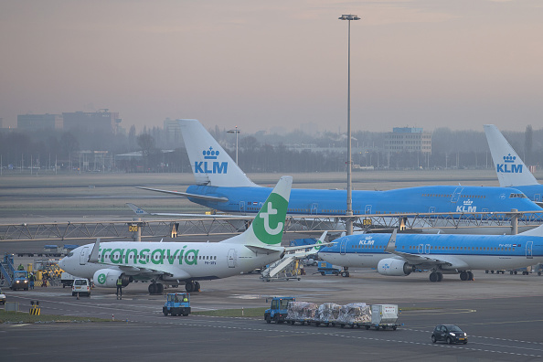 Passenger aircraft operated by KLM, the Dutch arm of Air France-KLM Group, sit on the tarmac beside a Transavia budget airliner, operated by Air France-KLM Group, at Schiphol Airport, operated by the Schiphol Group, in Amsterdam, Netherlands, on Tuesday, Jan. 19, 2016. 