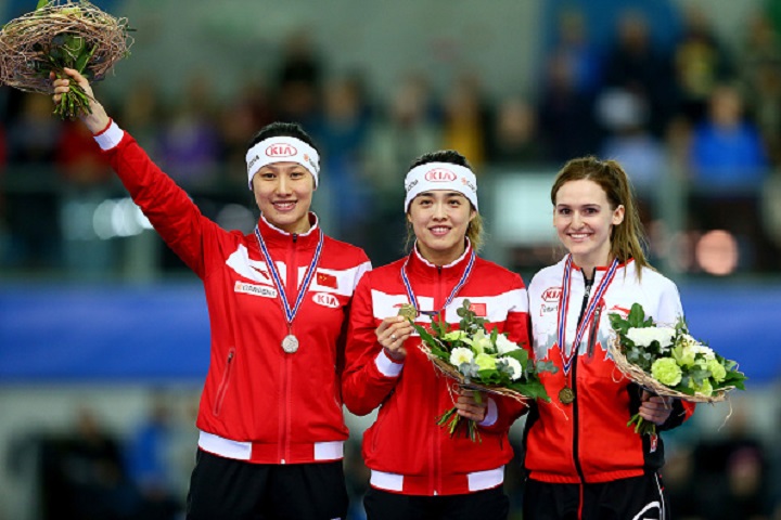 Hong Zhang and Jing Yu of China along with Winnipegger Heather McLean pose during the medal ceremony following the women's 500m race at the ISU Speed Skating World Cup in Stavanger, Norway.