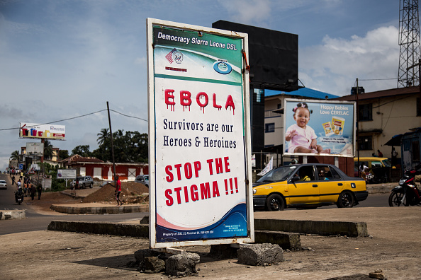 Billboard in Freetown, Sierra Leone reads 'Ebola, Survivors are our Heroes & Heroines. Stop The Stigma !!!'.