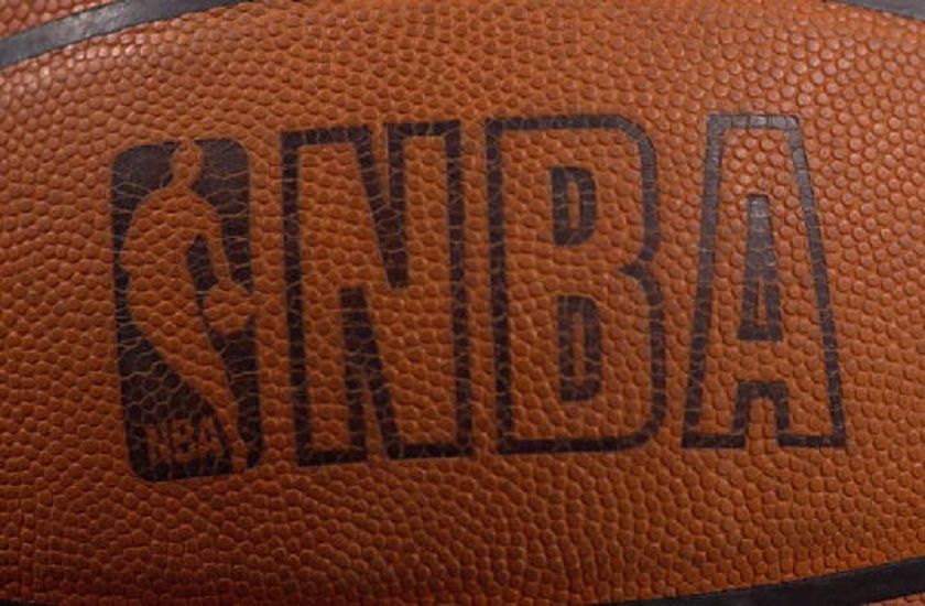 Photo of the NBA logo on a Spalding basketball.
