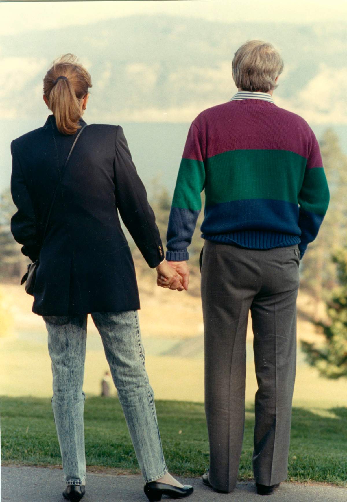 Brian and Mila hold hands