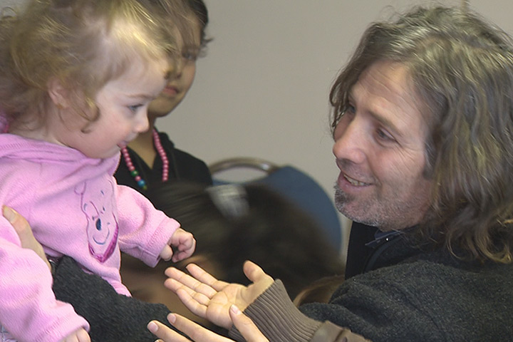 Basil Al-Zouwy plays with his young daughter