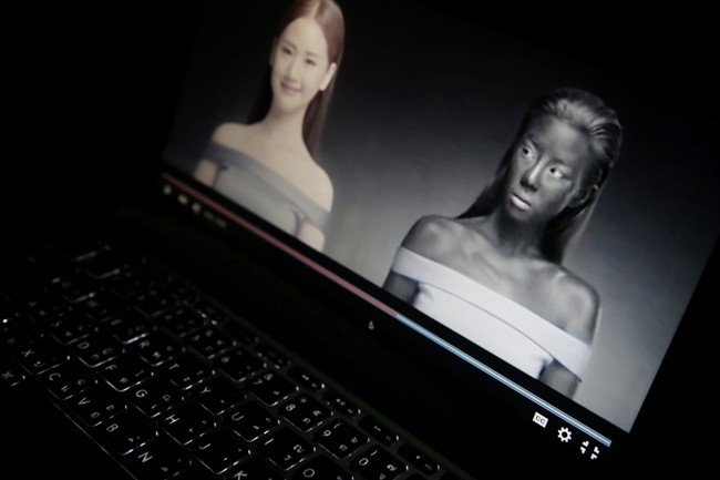An online advertisement by Thai cosmetics company Seoul Secret showing Thai actress Cris Horwang, right, is displayed on a computer screen in Bangkok, Thailand, Friday, Jan. 8, 2016.