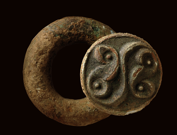 Late Iron Age baldric ring with La Tène style decoration, probably part of a shoulder belt for carrying a sword, found in the peat which formed in the Must Farm palaeochannel when then the watercourse became entirely choked by sediment at the end of the first millennium BC.