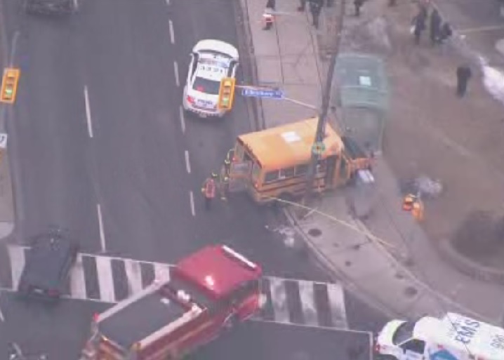 Emergency crews attend to the scene of a school bus crash in east-end Toronto on Jan. 28, 2016.