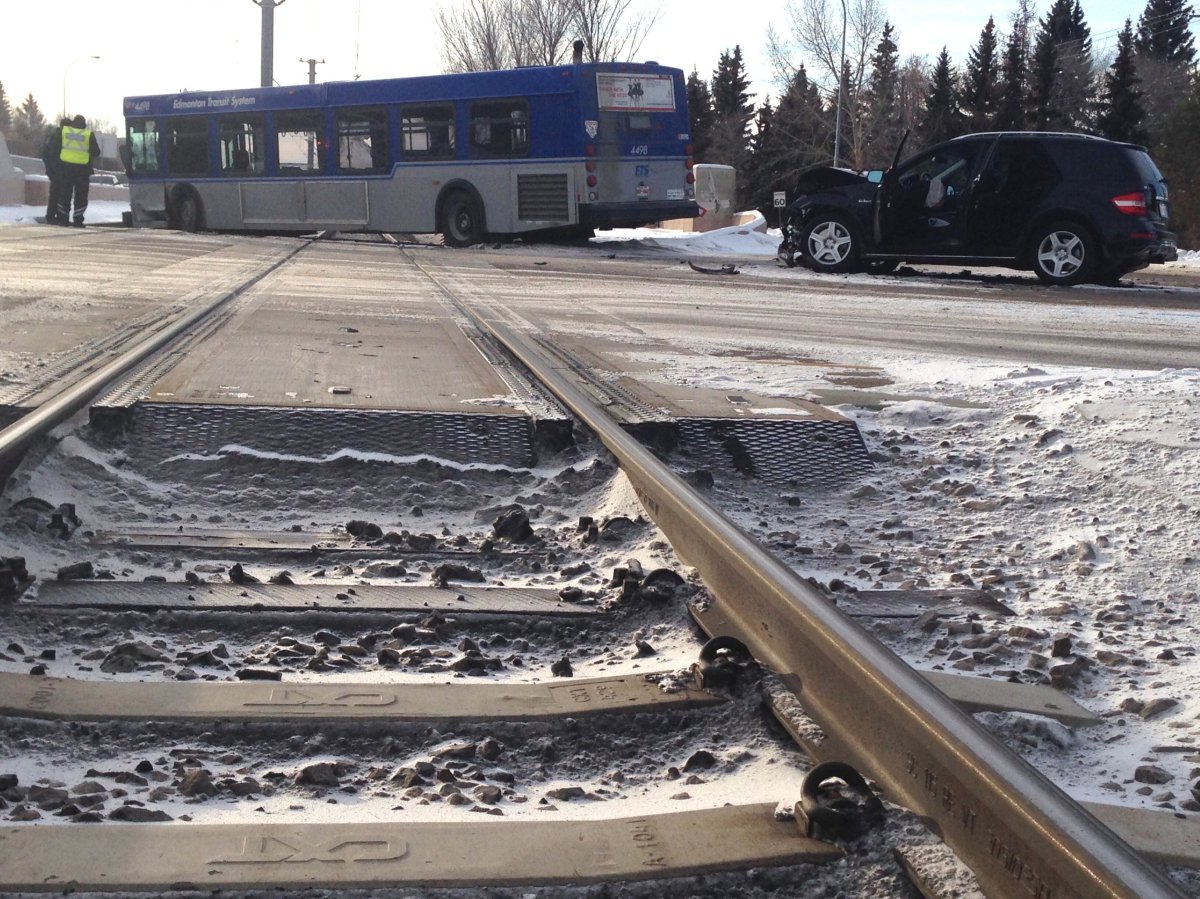 A City of Edmonton bus sits on LRT tracks after a collision involving the bus and an SUV, Sunday, Jan. 17, 2016. 