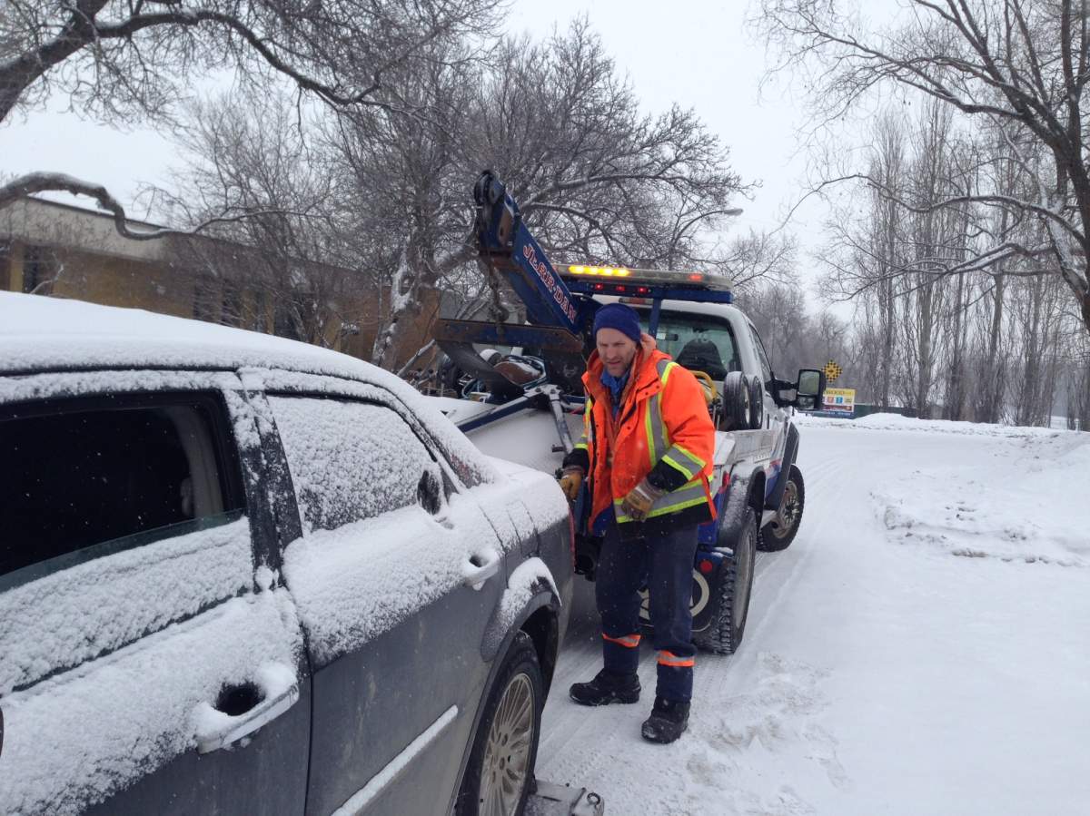 CAA driver works on hooking up a car Monday morning.