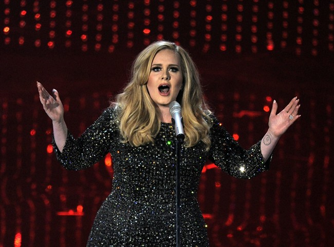 In this Feb. 24, 2013 file photo, singer Adele performs during the Oscars at the Dolby Theatre in Los Angeles. Adele has outpaced Psy on the race to 1 billion views on YouTube. The streaming service announced on Thursday, Jan. 21, 2016, that the music video for "Hello" greeted its 1 billionth view in 87 days, breaking the 158-day record previously held by Psy’s "Gangnam Style.".