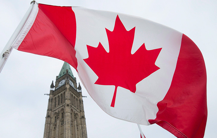 The Canadian flag flies on Parliament Hill in Ottawa, Friday December 4, 2015. 