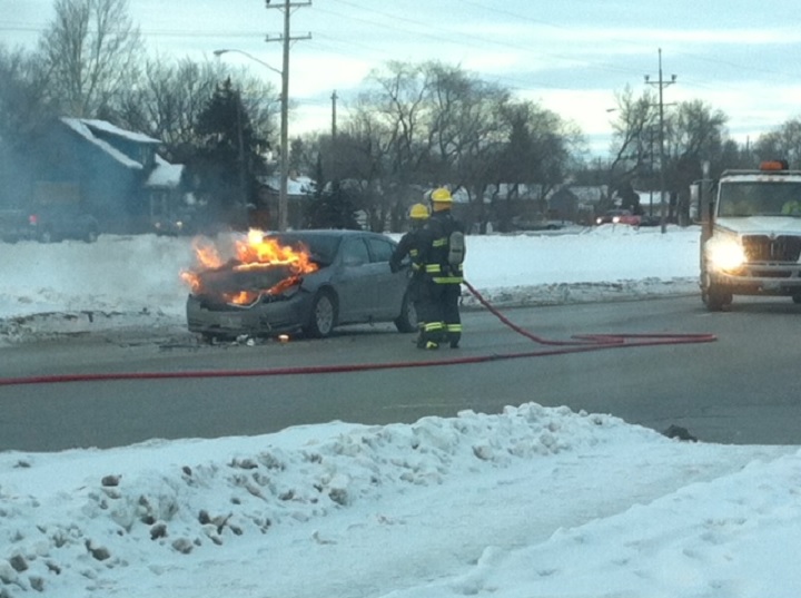 A car fire brought traffic to a halt on a busy route in North Kildonan Tuesday.