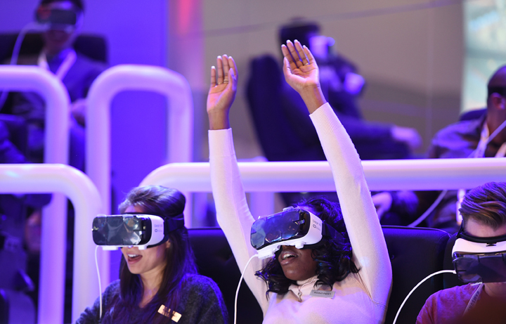 Attendees react to a demonstration of the Samsung Gear VR virtual reality headset at the Las Vegas Convention Center, January 5, 2016.