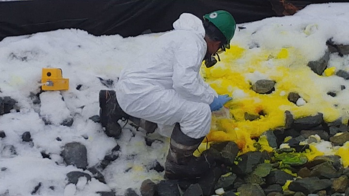 A South Island crew member works on cleaning up a suspicious chemical dumped in Shawnigan Lake, B.C.