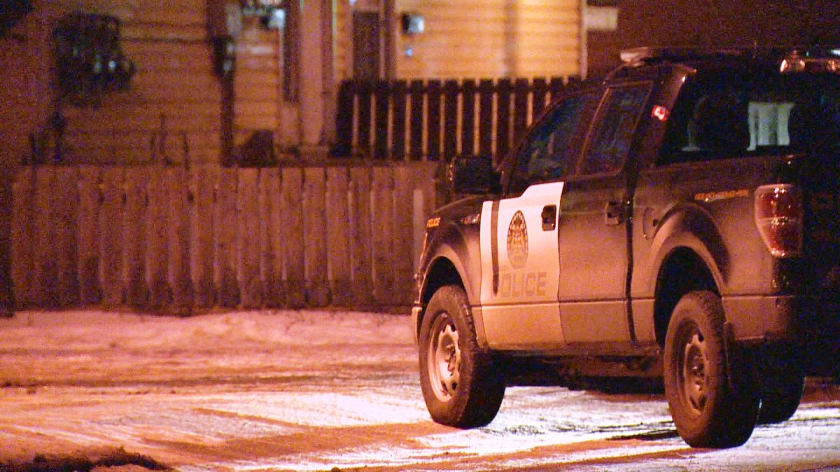 Calgary police investigate a home invasion in the 1400 block of 43 Street S.E. on Monday, January 4, 2016. 