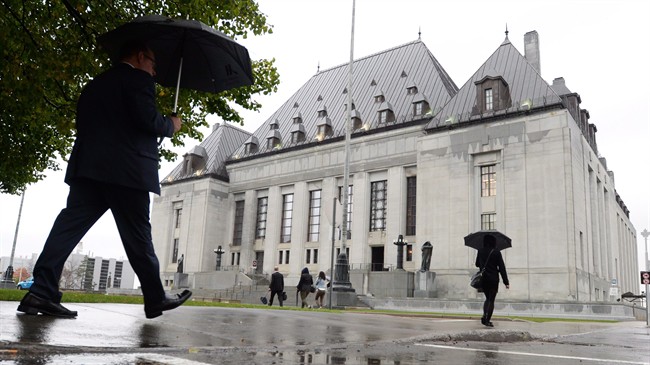 The Supreme Court of Canada building is pictured, in Ottawa. The Trudeau government appears to be in no hurry to grapple with the explosive issue of doctor-assisted dying, even as it prepares to urge the Supreme Court next week to give it more time to craft a new law on the matter. 