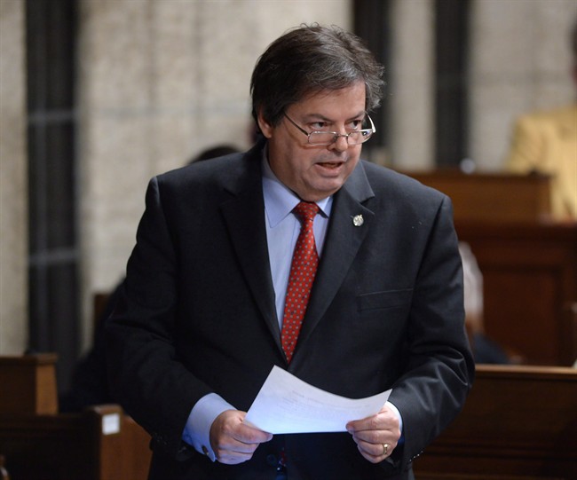 Liberal MP Mauril Belanger answers a question during question period in Ottawa, on Dec. 7, 2015. Belanger died last summer, and his bid to change the lyrics to O Canada has since stalled in the Senate.