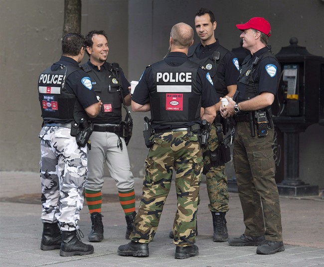 Montreal Police officers are shown on a street in Montreal on August 7, 2014.