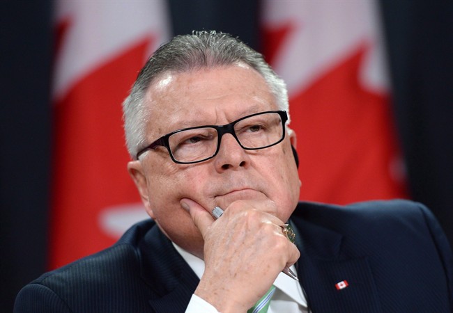 Ralph Goodale, Minister of Public Safety and Emergency Preparedness listens to a question during a press conference at the National Press Theatre in Ottawa on Tuesday, Nov. 24, 2015. 