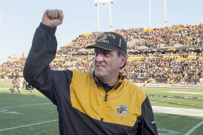 Hamilton Tiger-Cats' head coach Kent Austin celebrates after winning the CFL Eastern Division Semifinal against the Toronto Argonauts in Hamilton, Ont., on Sunday, Nov. 15, 2015. 