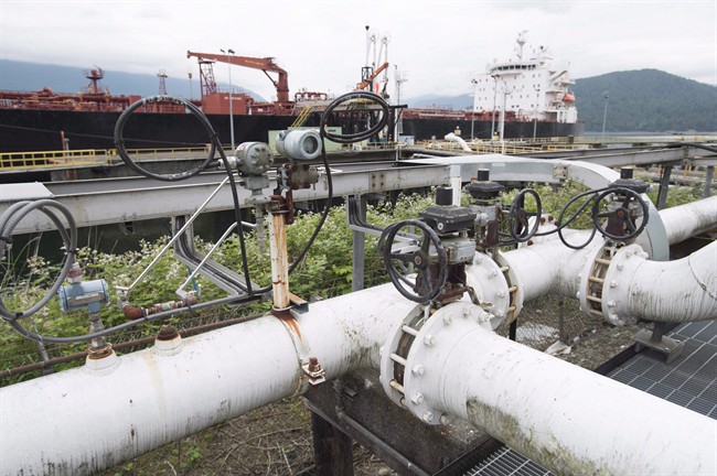 A ship receives its load of oil from the Kinder Morgan Trans Mountain Expansion Project's Westeridge loading dock in Burnaby, British Columbia, on June 4, 2015. 
