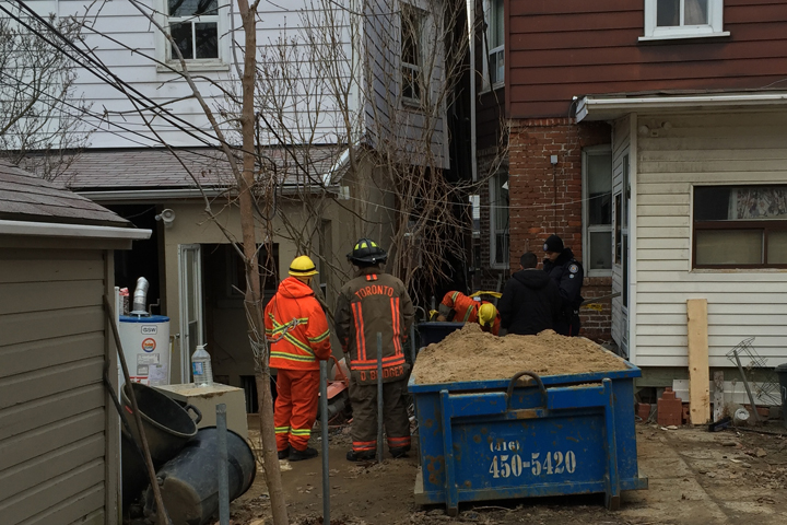 Rescue crews evacuated two neighbouring homes after a partial wall collapse on Coxwell Avenue Saturday.