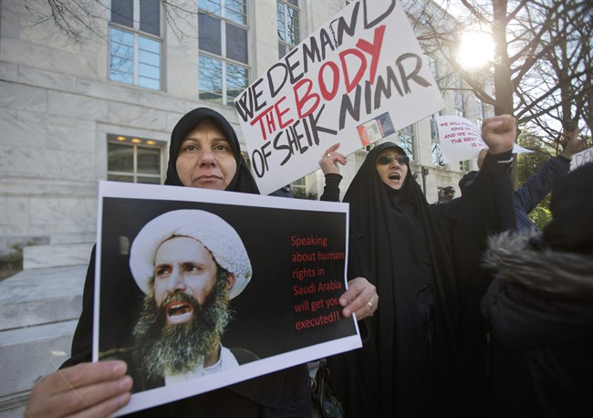 Amel Al-Hajjar, left, and Khadija Falih, both from Iraq, participate in a rally in front of the Saudi Arabian embassy in Washington, Tuesday, Jan. 5, 2016, to protest the mass executions in Saudi Arabia. Saudi Arabia executed last Saturday, Shiite cleric Sheikh Nimr al-Nimr and 46 others convicted of terror charges, the largest mass execution carried out by the kingdom since 1980. 