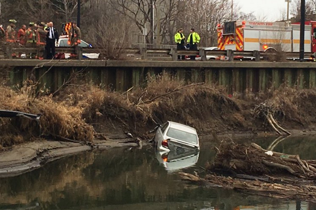 A driver escaped unscathed after their car flipped into the Don River Sunday morning.