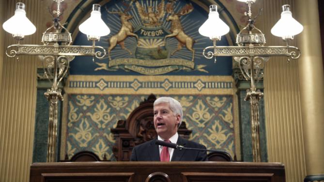Michigan Gov. Rick Snyder delivers his State of the State address to a joint session of the House and Senate, Tuesday, Jan. 19, 2016, at the state Capitol in Lansing, Mich. 