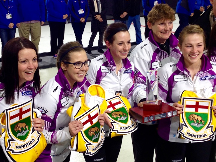 Skip Kerri Einarson, third Selena Kaatz, second Liz Fyfe, coach Patti Wuthrich and lead Kristin MacCuish pose after winning the 2016 Manitoba Scotties in Beausejour.