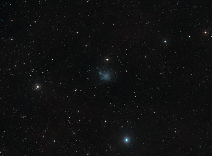 This wide-field view shows the sky around the dwarf galaxy IC 1613 in the constellation of Cetus.