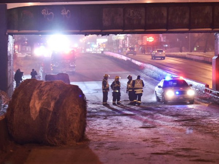 Hay bales fall of truck on Portage Avenue Thursday night. 