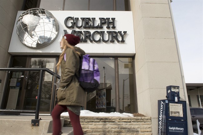 A woman walks by the Guelph Mercury office on Jan. 25, 2016, the day it announced layoffs and the end of its print edition. A House of Commons committee will investigate the state of local media.