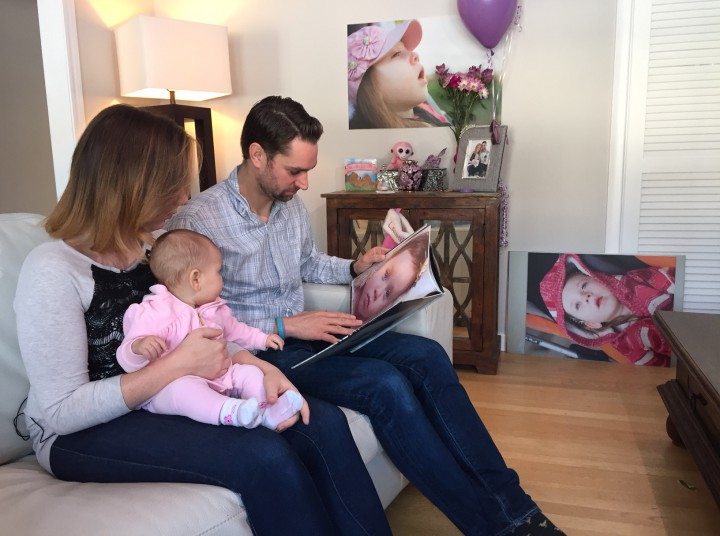 Amanda Zarifah, Stephen Loughheed and their 6-month-old daughter, Zoe, look at photos of Lauren in their home, Tuesday, January 5, 2016.